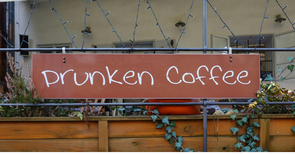 A Sign with a Name of a Cafe