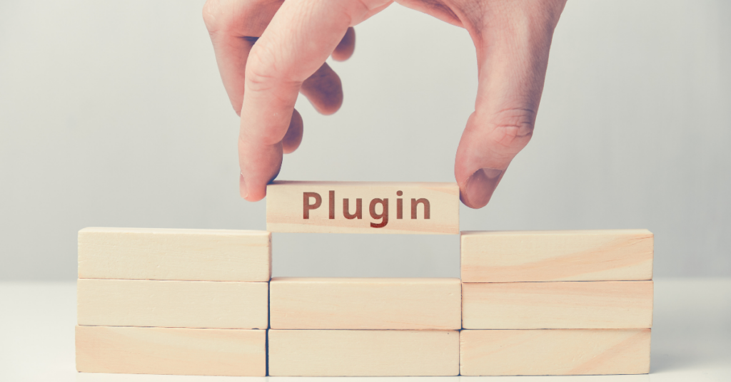 An image of stack up blocks and a hand holding one block written plugin