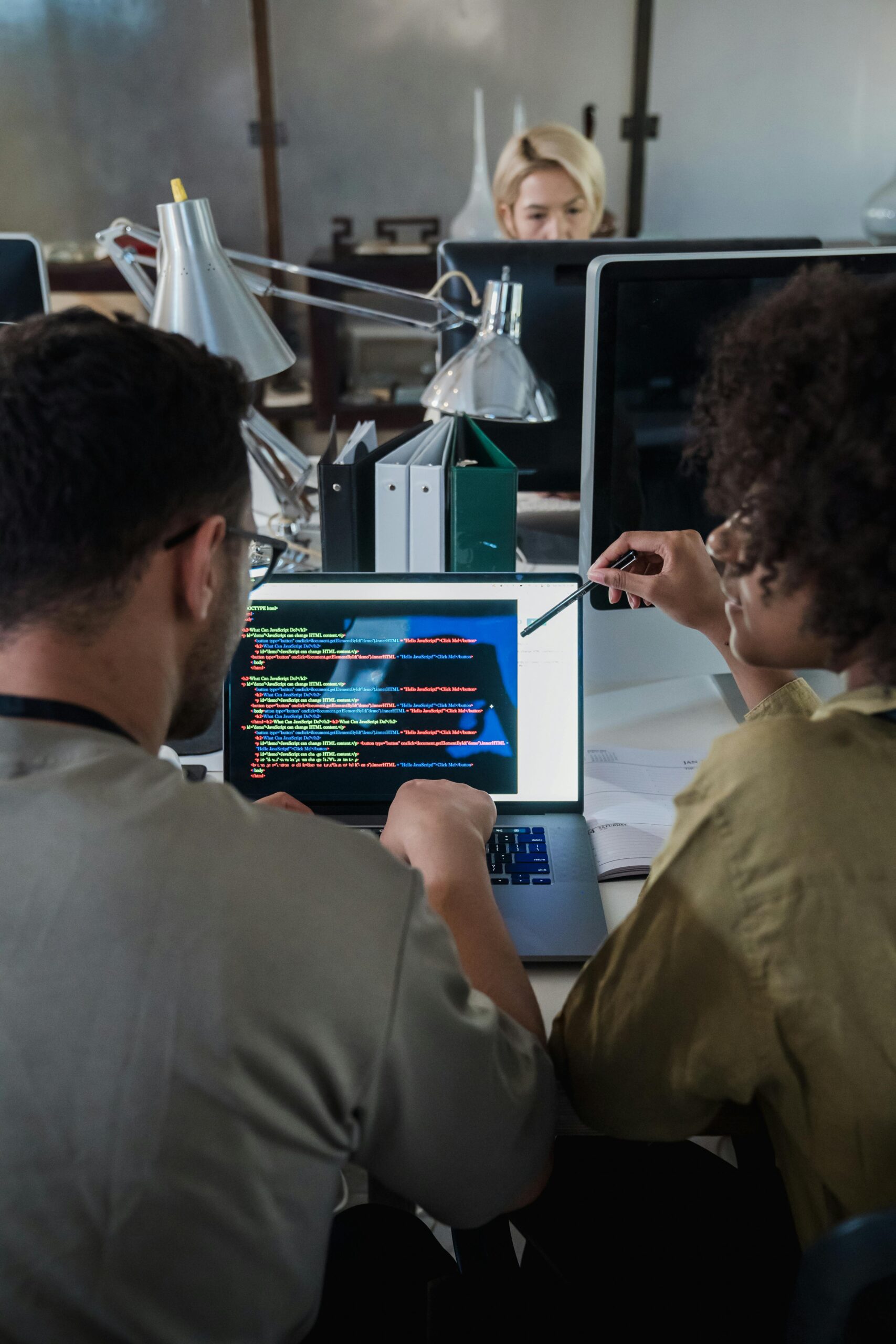 A team working on a saas software in a companies office for saas companies website hosting